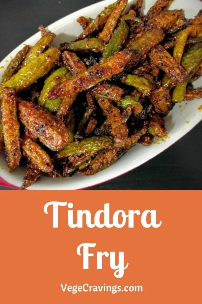 Tindora fry or dondakaya fry is a delicious & tangy Andhra-style dish made by stir frying thinly sliced tindora tempered with various spices.