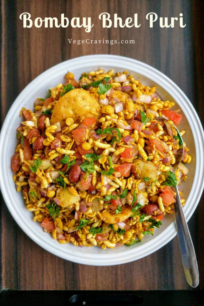 Bhel puri is a Mumbai street food chaat made with puffed rice, boiled potatoes, onion, tomato & sweet-tangy chutneys, tossed just before serving.
