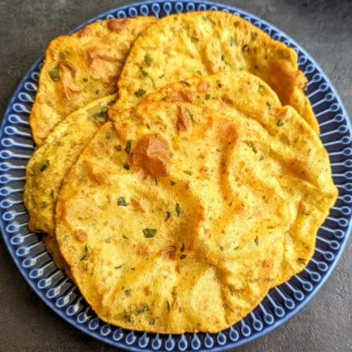 Moong methi masala poori is a spicy, crispy, deep fried flatbread made with fenugreek leaves, moong dal & spices mixed with wheat flour dough.