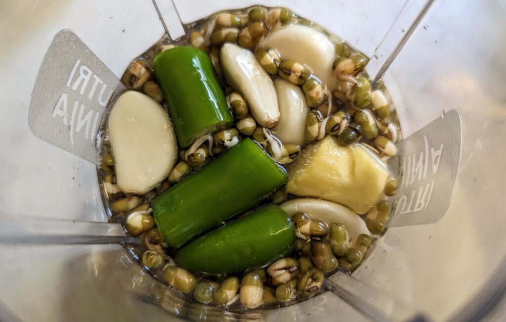 Green Moong Dal Chilla Recipe Step 2 - moong dal with ginger garlic green chillies