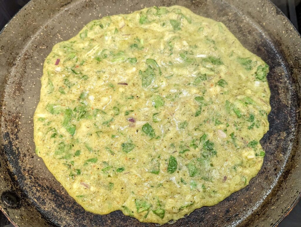 Green Moong Dal Chilla Recipe Step - spread the batter